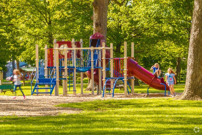 Children play on the colorful playground at Collett Park.