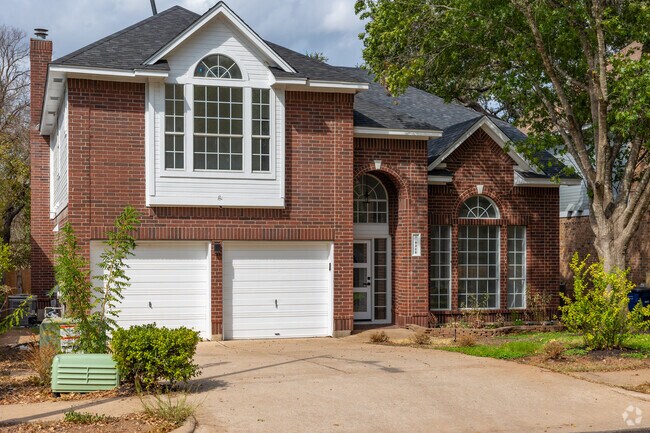 A nicely sized brick two-story home common in Maple Run.