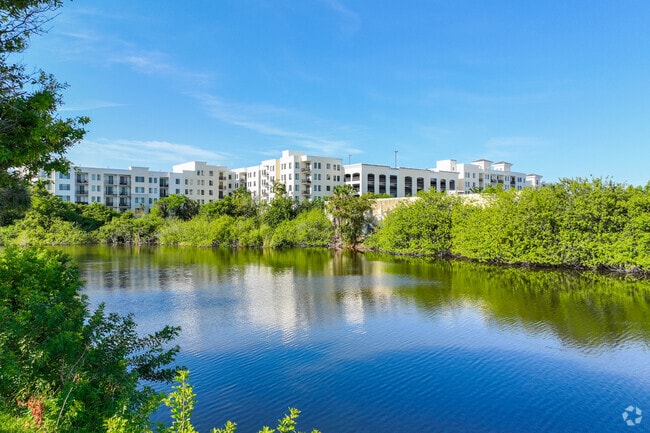 Beautiful lake view of a condominium complex in Highlands neighborhood