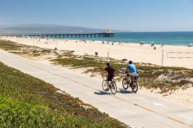 Marvin Braude Bike Trail runs through Manhattan Beach and separates luxury homes from soft sand.