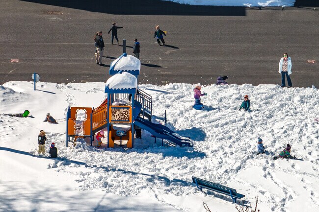 Children brave the snow during recess at Seneca Street School, in Oneida.
