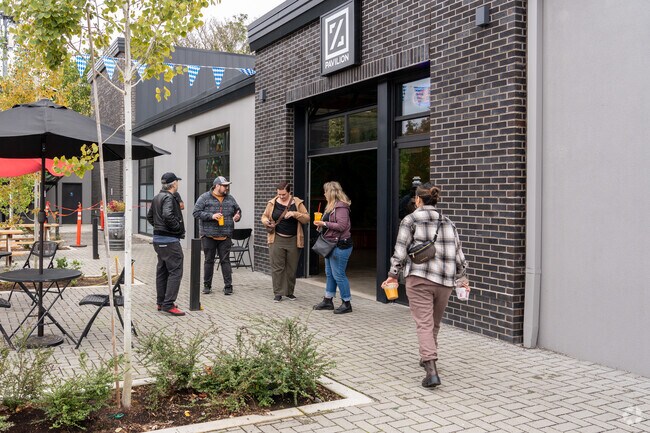 Friends enjoy the outdoor dining options in the Mill Park neighborhood.