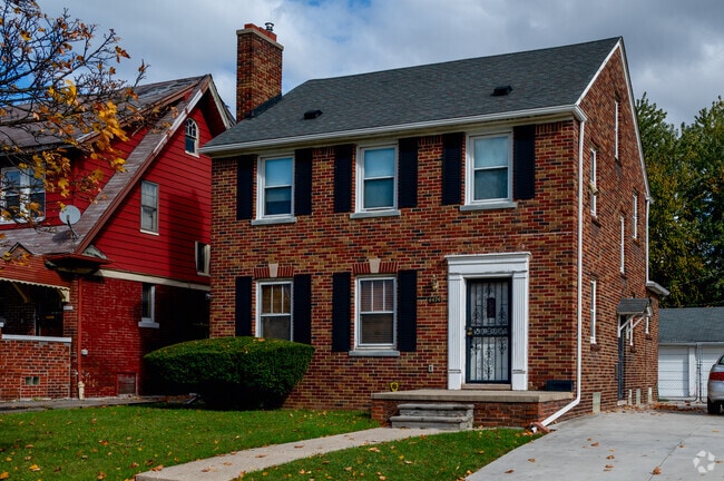 A Colonial Revival home in Pingree Park are shaded by the trees in the neighborhood.