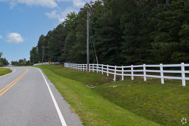 White picket fences line Highway 62 in Frasier Marsh.