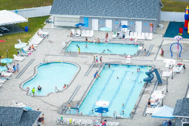 Kids and families relax at the private club pool in North Swansea's Swansea Country Club.