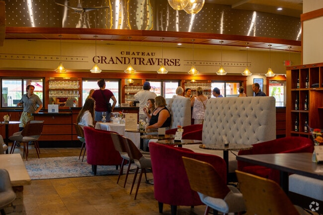 Chateau Grand Traverse’s dining area blends rustic wood with modern metal wall panels.