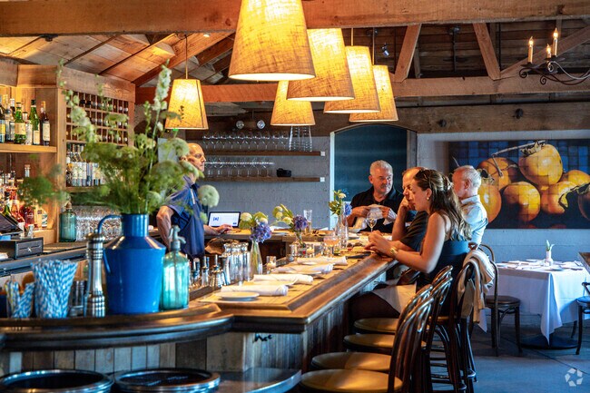 Angèle Restaurant and Bar is a local favorite known for its French menu and riverfront patio.