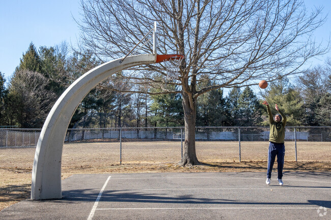 A resident enjoys practicing shots at the basketball court in Summerfield Park in Dayton.
