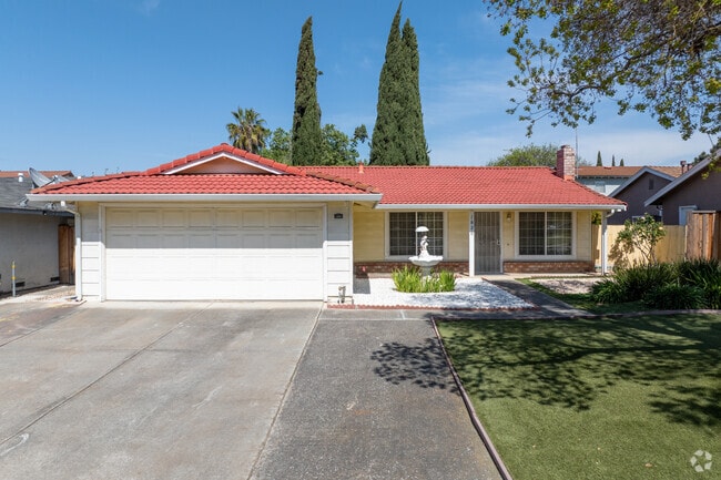 Ranch-style home in Vinci South features a red tile roof, fountain, and drought-friendly yard.