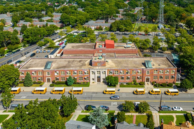 Bus lines up form students in front of PS 811Q during school closing time