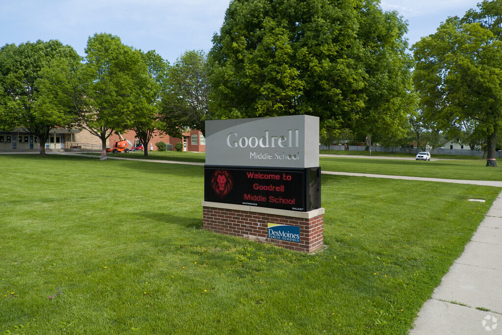 Goodrell Middle School's sign sits atop a lush field of grass.