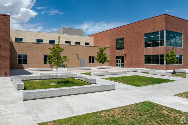Small lawns and concrete benches beautify Mountain Creek Middle School’s courtyard.