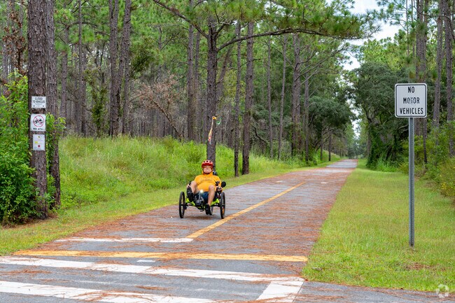 Cyclists make themselves known with bright colors, flags and lights at the Good Neighbor Trail.