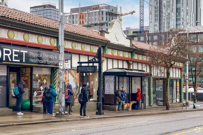 Young and old gather for the bus leaving the University District.