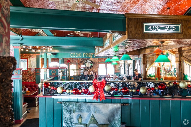 A Getzville restaurant delights the senses with bright colors and a detailed ceiling.