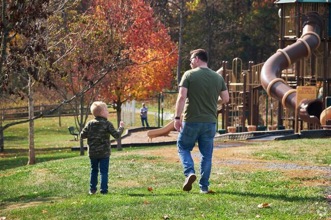 Parents and children enjoy Rockland Park's beauty and great playgrounds.