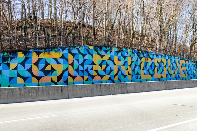 The mural on Route 107 welcomes motorists to Glen Cove.