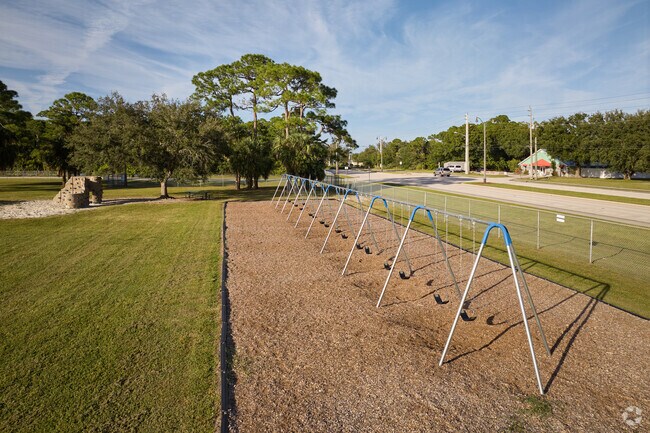 Village Green Elementary School has multiple swing sets for children to enjoy.