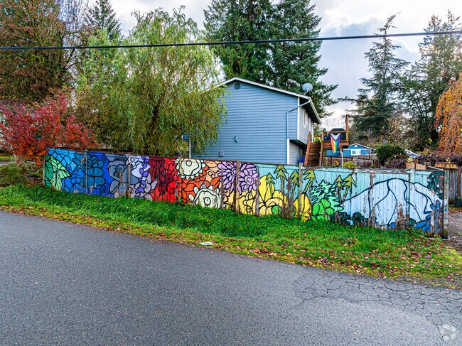 The Cherry Gardens neighborhood has a small-town artsy vibe like this colorful fence mural.