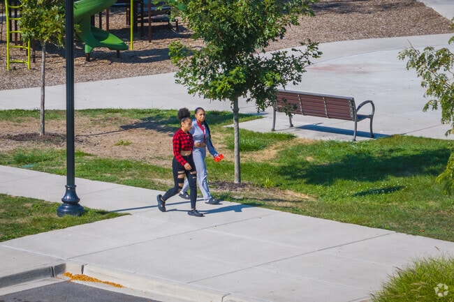 These girls walk through Labor Park on their way to Navarre Branch Library.