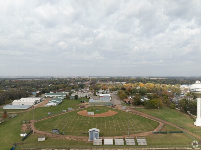 Ray Plut Park offers comprehensive recreation with a baseball field, playground, basketball court, pool, pavilion, and swing set for family fun and community activities.