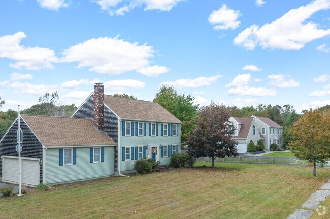 A row of large Colonial homes in North Pembroke.