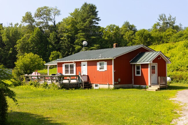 Towering trees in Sharon often provide a backdrop to cozy cottage-style houses.