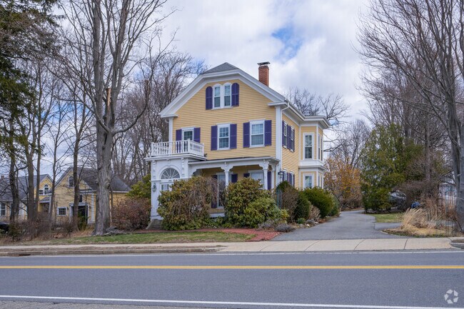 Large Colonial Revival-style homes sit along the shores of Lake Quannapowitt in Lakeside.
