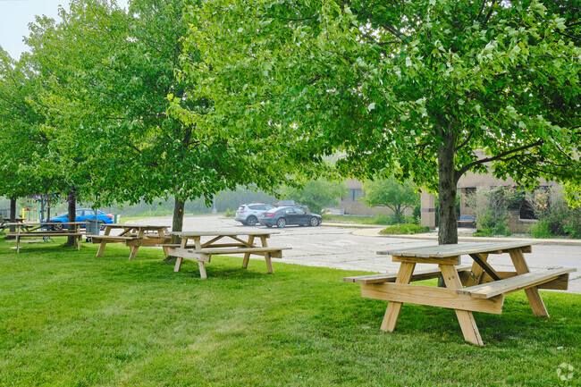 Picnic tables along the play area allow teachers and students to relax on recess.