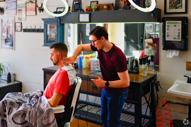 One of the friendly barbers at Williamston Barbershop provides an extra level of detail.
