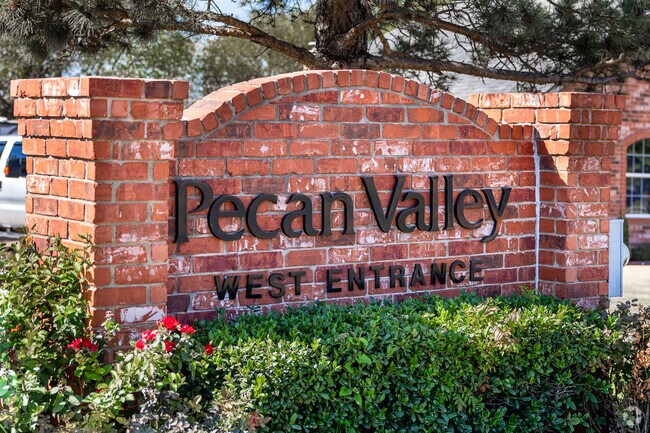 The entry for Pecan Valley greets you with a large red-brick sign.