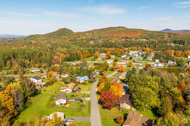 Scenic East Barre neighborhood nestled on a hillside with panoramic views of Vermont’s Green Mountains, offering rural charm and privacy.