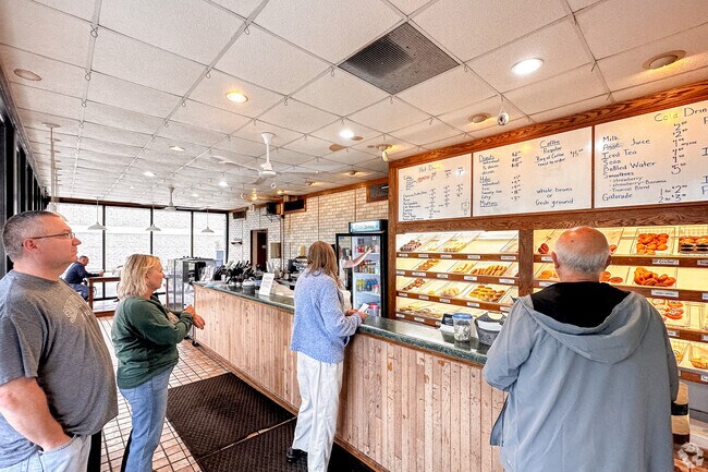 Enjoy a delicious donut with fresh, hot coffee at CJ's Coffee House in Zion, IL.