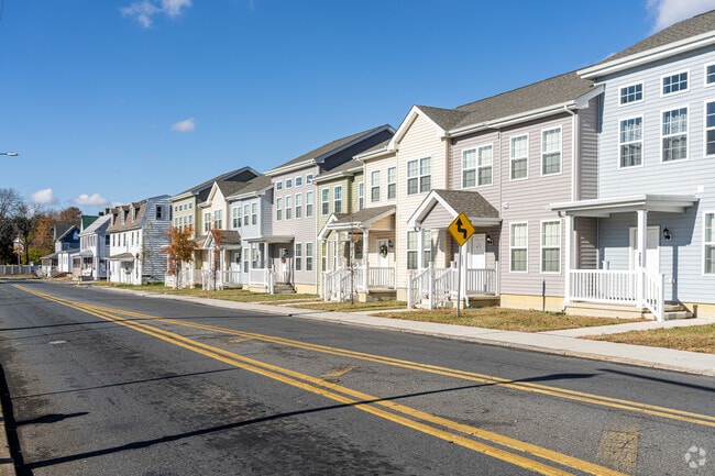 These Milford townhomes are built with varying facades to avoid the typical rowhome look.