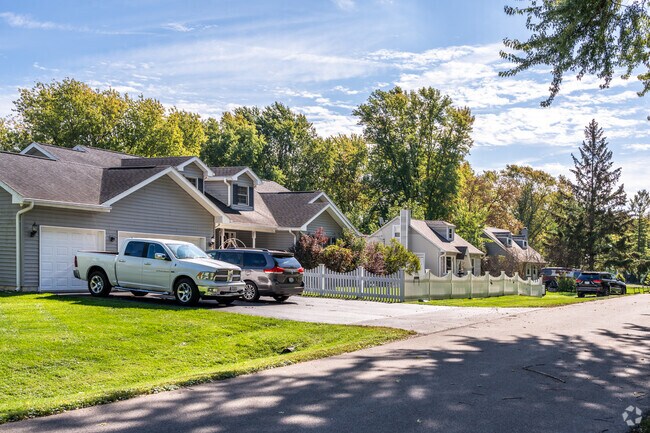 Several ranch style homes line a street in the Venetian Village neighborhood.