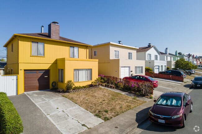 A row of brightly colored mid century homes in Serra Highlands.