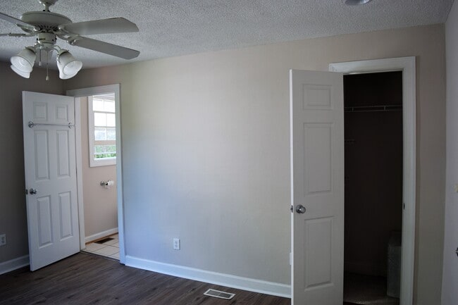 Front bedroom with adjacent bathroom and closet