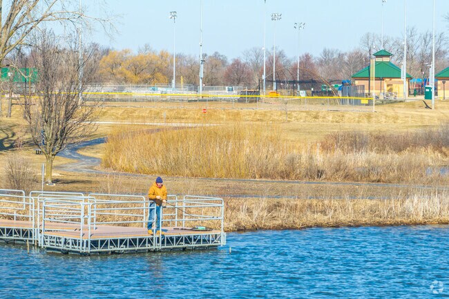 Residents enjoy year-round fishing at the lake in Centennial Park.