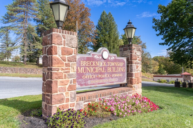 A brick sign welcomes visitors to Brecknock Township Lancaster with classic charm.