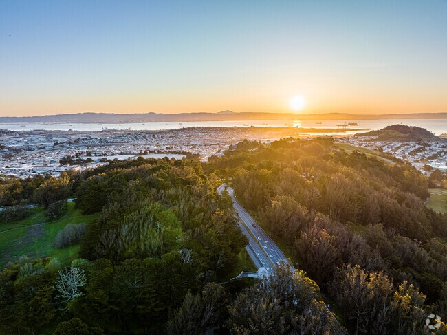 A beautiful sunrise is seen above John McLaren Park.