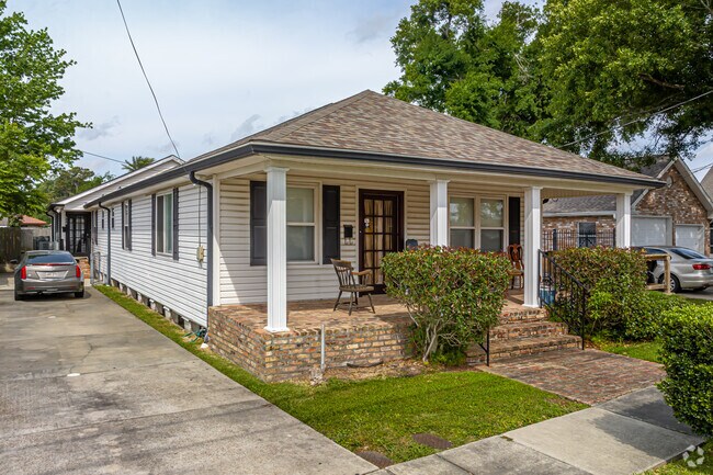 The Acadian style home offers an open concept with a large front porch in Metairie Terrace.