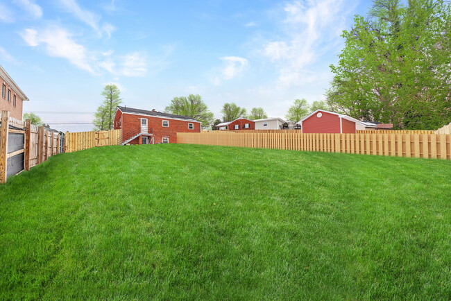 Rear fenced yard great for entertaining, gardening, pets or others!