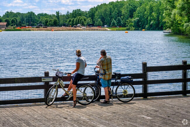 Take a break while riding your bike to admire the lake in Hawk Island Park in Forest View.
