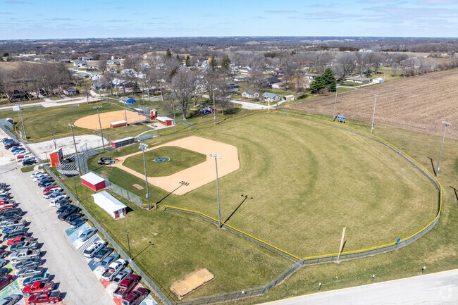 Baseball and softball fields are adjacent to the school to the west.