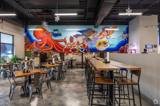 Murals add vibrant color inside Isla del Mar in South Central Omaha.