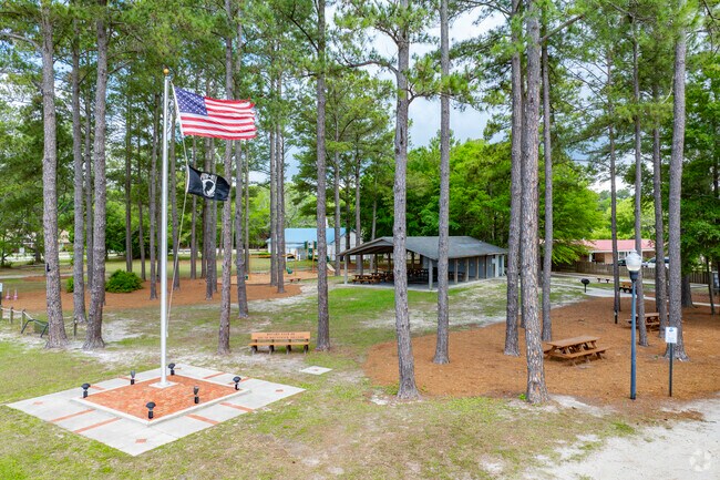Calabash Community Park, located at 868 Persimmon Road, serves as a central gathering spot in Calabash, NC, offering walking trails, picnic areas, and playgrounds for residents and visitors alike.