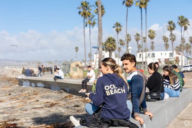 A couple enjoys lunch at the boardwalk at Ocean Beach.