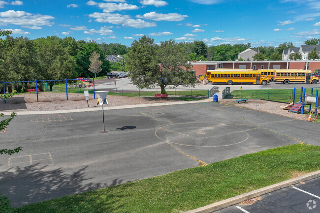 Whitehall Elementary School has a large blacktop for students.