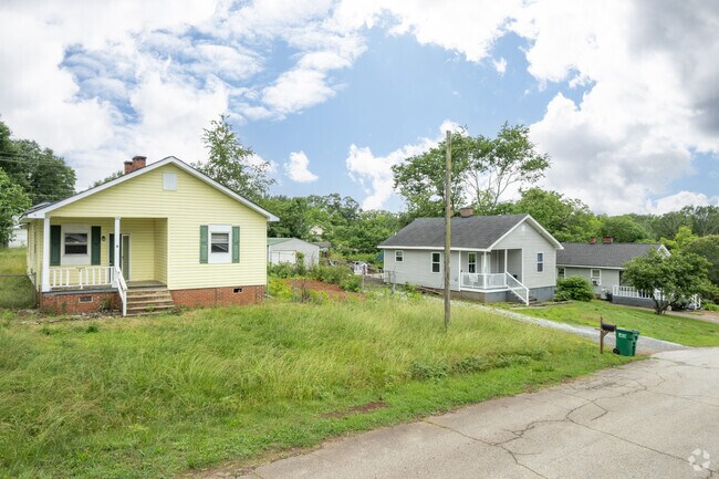 Bungalow houses are located in close proximity to each other in Valley Falls.