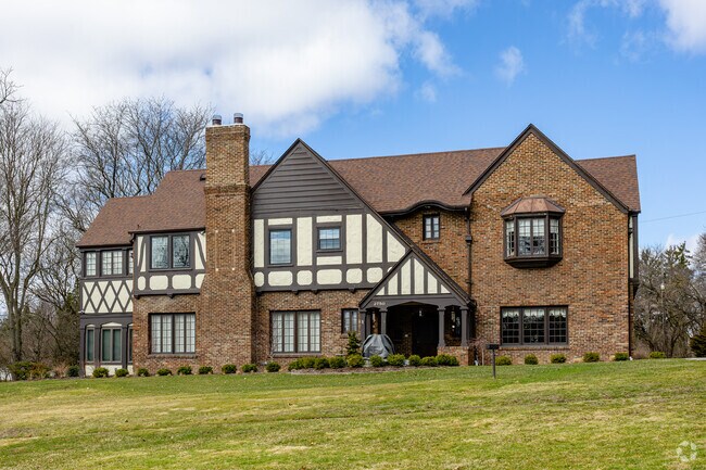 Regal looking Tudor Revival homes are another common architectural style in Woodcroft Estates.